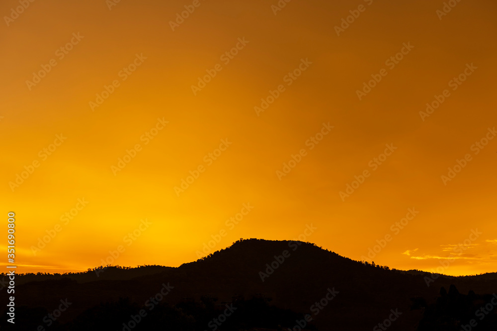 Forest Silhouette on background of Beautiful dark orange clouds. Forest Silhouette on background of Beautiful dark orange clouds.
