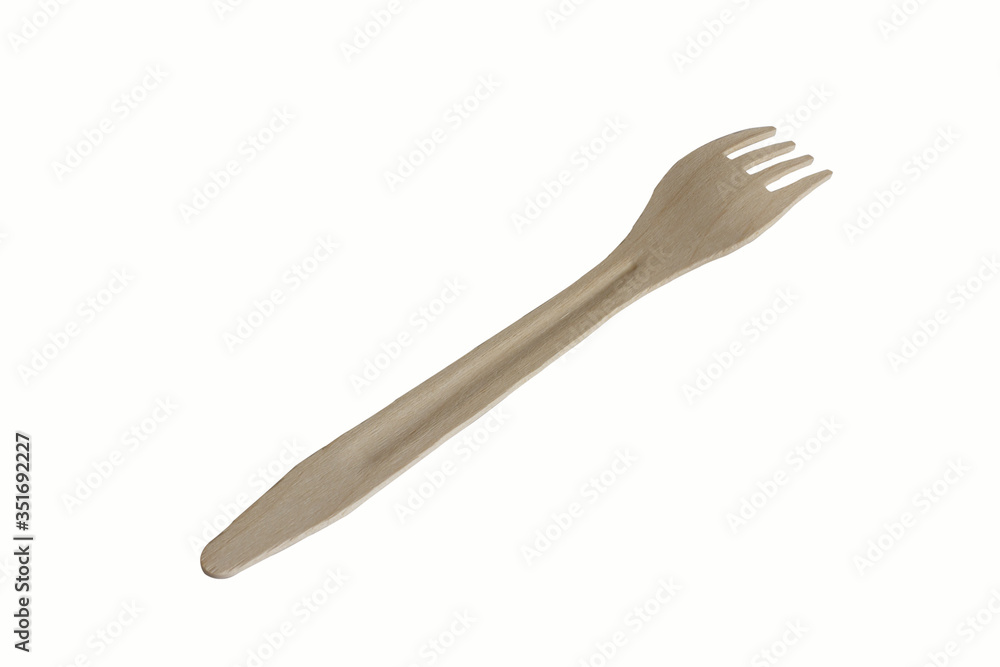A wooden disposable fork, insulated on a white background A wooden disposable fork, insulated on a white background
