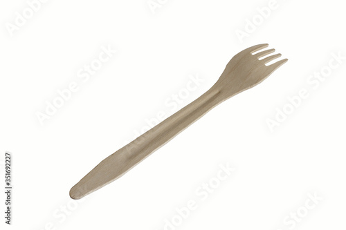 A wooden disposable fork, insulated on a white background