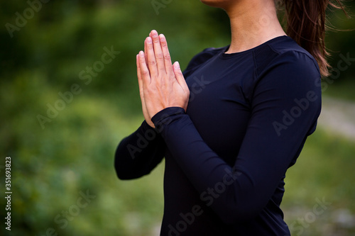 Woman doing yoga meditation in nature 