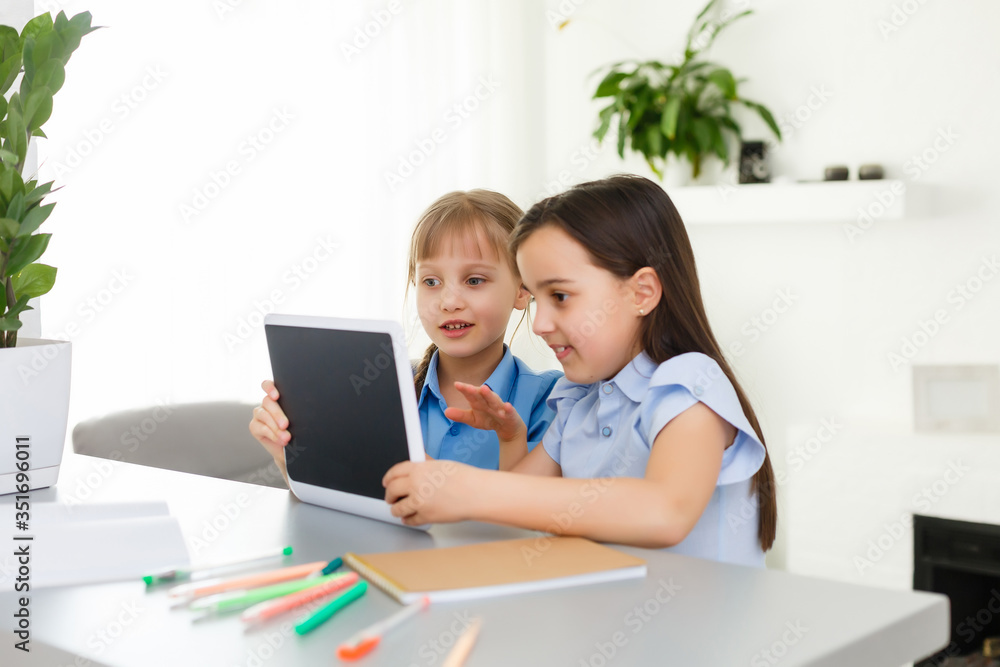 Learning from home, Home school kid concept. Little children study online learning from home with laptop. Quarantine and Social distancing concept. Learning from home, Home school kid concept. Little children study online learning from home with laptop. Quarantine and Social distancing concept.