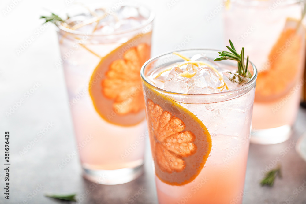 Grapefruit cocktail with rosemary, refreshing cold drink - obrazy, fototapety, plakaty 