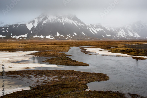 Mountain landscape and frozen lake in winter in Iceland