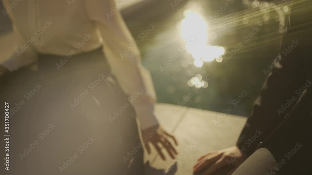 A couple holding hand by the pond (slow motion 120fps) A couple holding hand by the pond (slow motion 120fps)