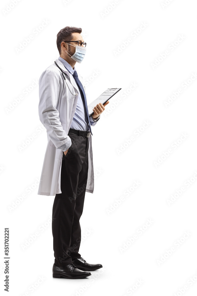 Male doctor with a protective face mask holding a clipboard
