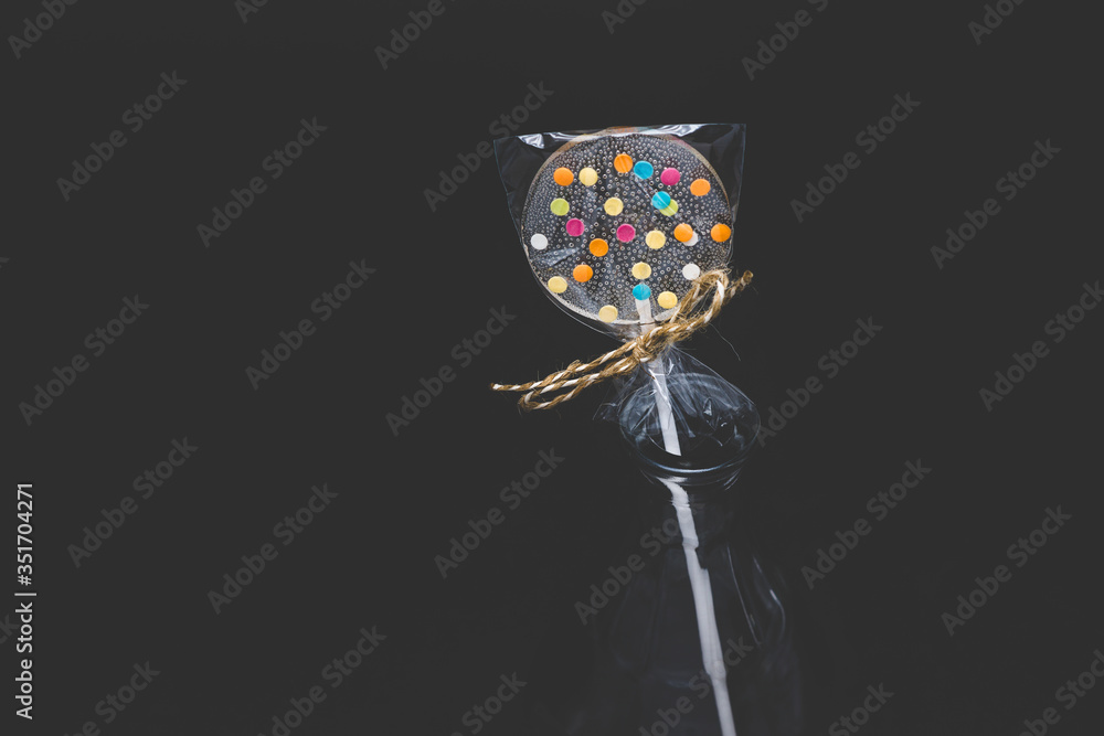 Diet curly lollipops. Transparent and with bright elements.