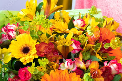 Fototapeta Naklejka Na Ścianę i Meble -  Bright yellow gerbera and alstroemeria in a bouquet of flowers. Beautiful bouquet gift for the holiday.
