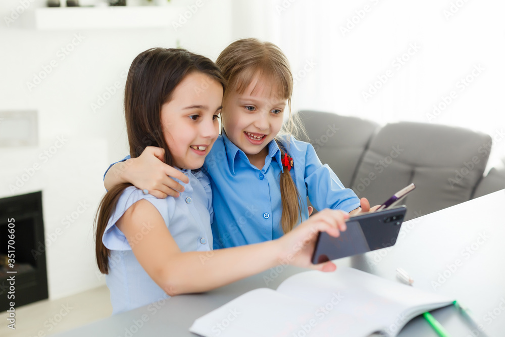 two little girls studying online. Distance Learning Online, e-learning, concept two little girls studying online. Distance Learning Online, e-learning, concept
