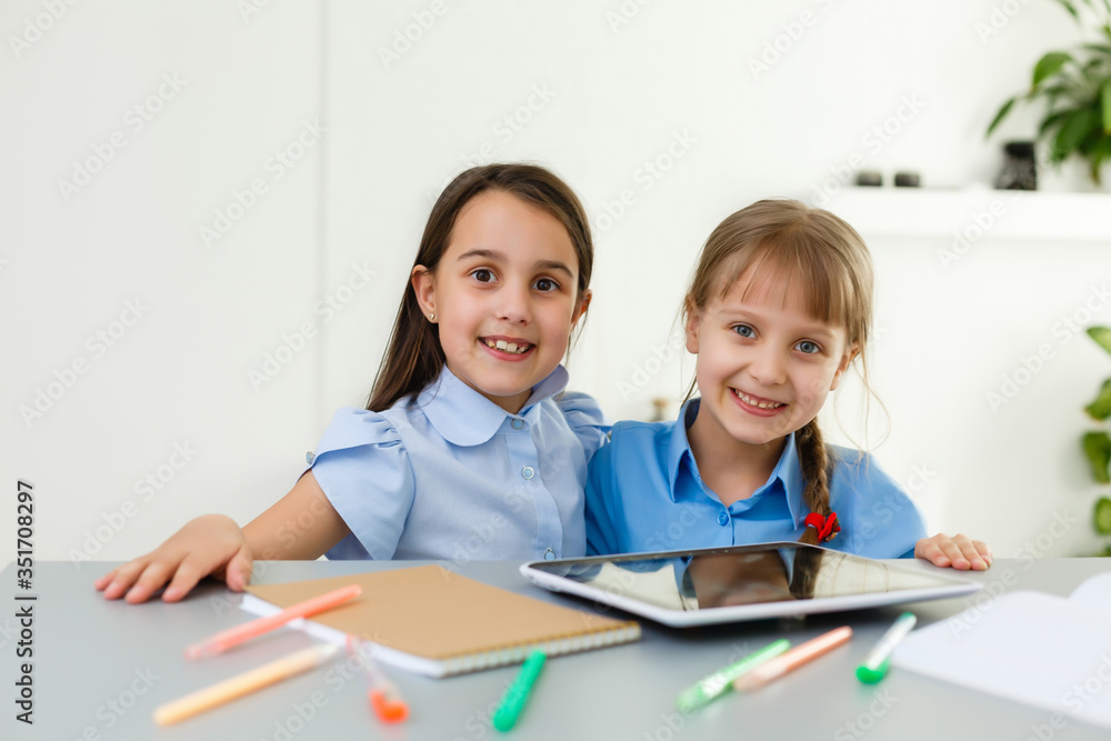 two little girls studying online. Distance Learning Online, e-learning, concept two little girls studying online. Distance Learning Online, e-learning, concept