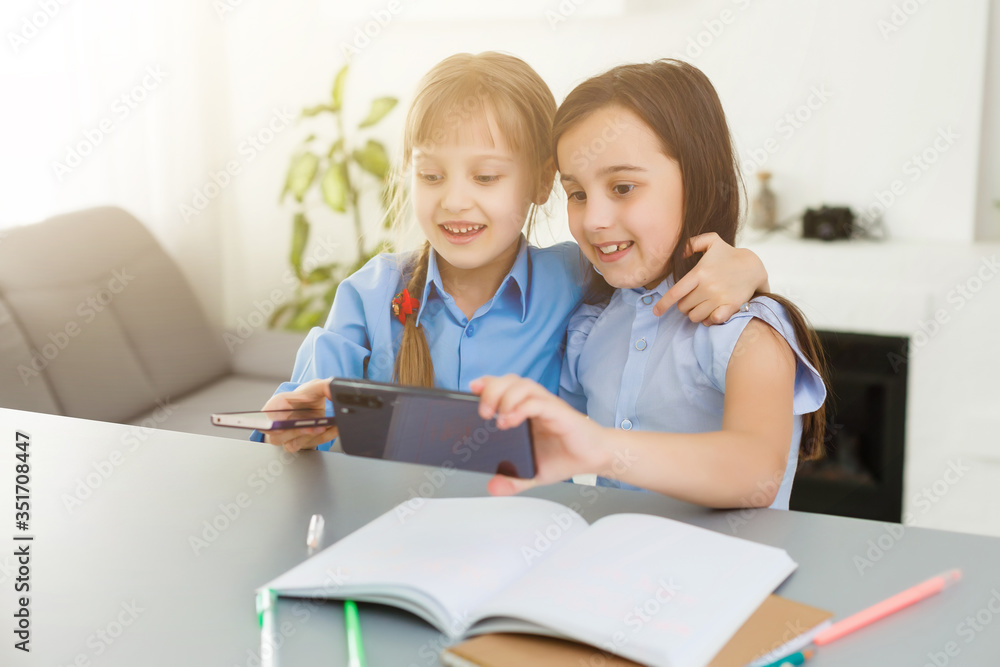 Learning from home, Home school kid concept. Little children study online learning from home with laptop. Quarantine and Social distancing concept. Learning from home, Home school kid concept. Little children study online learning from home with laptop. Quarantine and Social distancing concept.