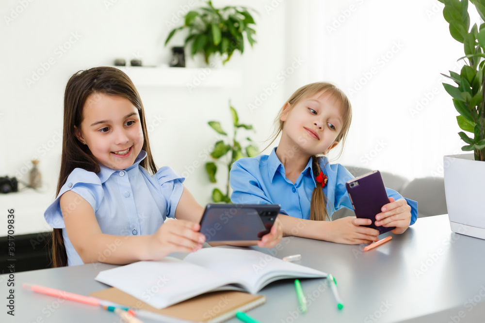 two little girls studying online. Distance Learning Online, e-learning, concept two little girls studying online. Distance Learning Online, e-learning, concept