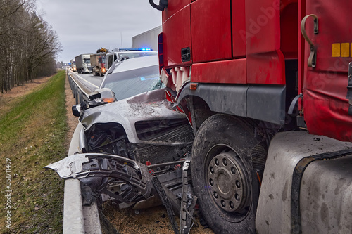 Vászonkép Car after a collision with a heavy truck