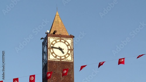 Tower clock with flags in Tunis, Tunisia