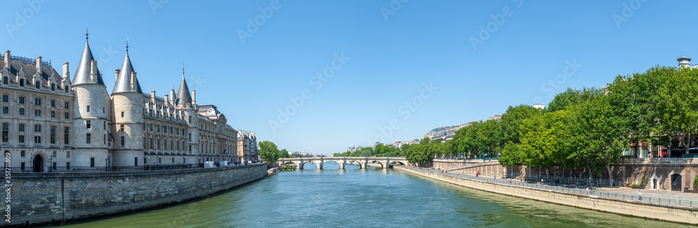 Panoramic view of Seine river with conciergerie palace and pont neuf - Ile de la Cite, Paris, France