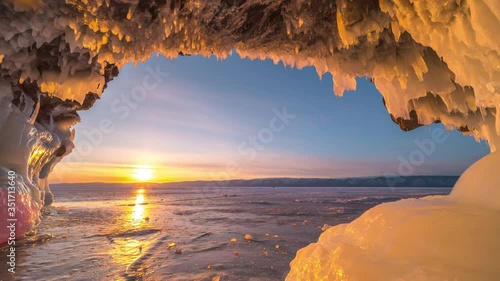 Winter. The cave in the rock is covered with ice. Lake Baikal