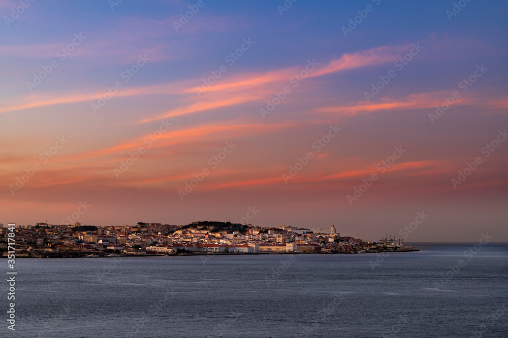 Panoramic view of the skyline of the city of Lisbon at sunset, in Portugal