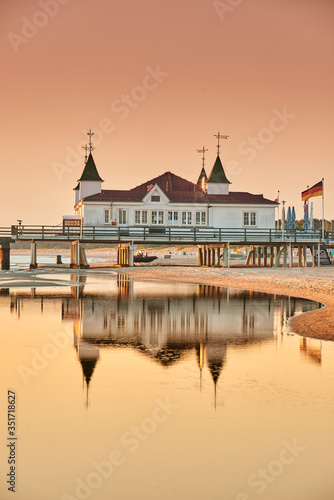 Fototapeta Naklejka Na Ścianę i Meble -  morning time at baltic sea beach and sight Ahlbeck pier in sunrise