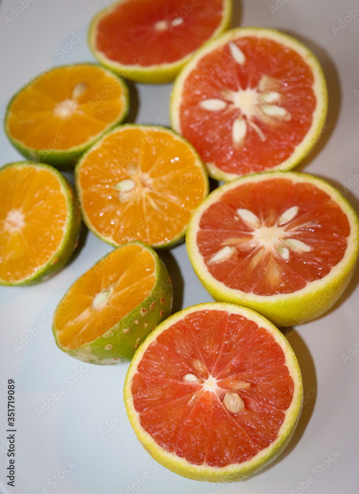 Beautiful lemons and grapefruits cut in half on a cutting board. Beautiful lemons and grapefruits cut in half on a cutting board.