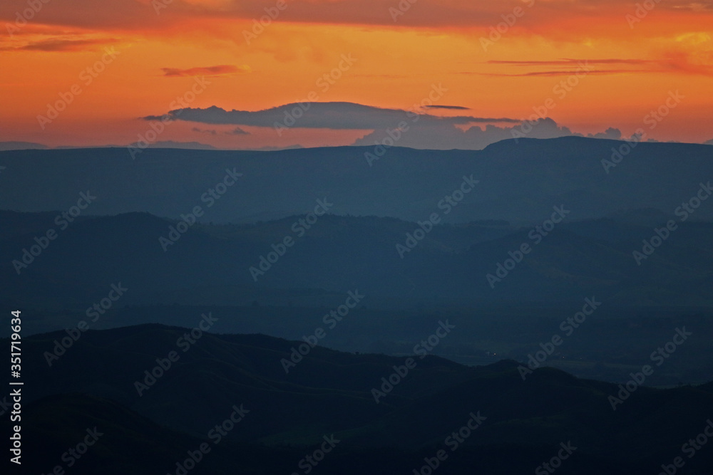 mountains and valleys during dusk
