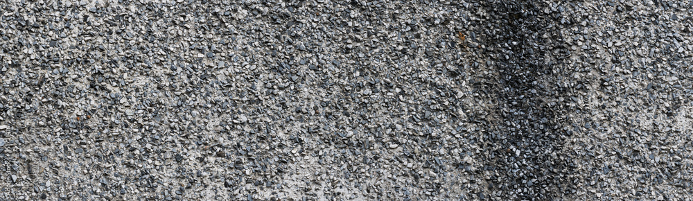 Panoramic texture of old gray concrete wall. Old rough plastered wall. Panoramic texture of old gray concrete wall. Old rough plastered wall.