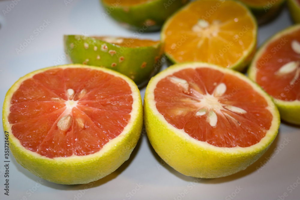 Beautiful lemons and grapefruits cut in half on a cutting board. Beautiful lemons and grapefruits cut in half on a cutting board.