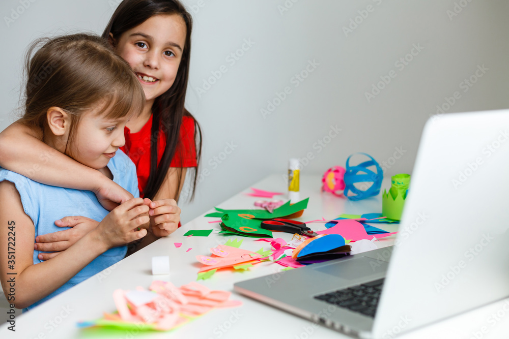 Learning from home, Home school kid concept. Little children study online learning from home with laptop. Quarantine and Social distancing concept. Learning from home, Home school kid concept. Little children study online learning from home with laptop. Quarantine and Social distancing concept.
