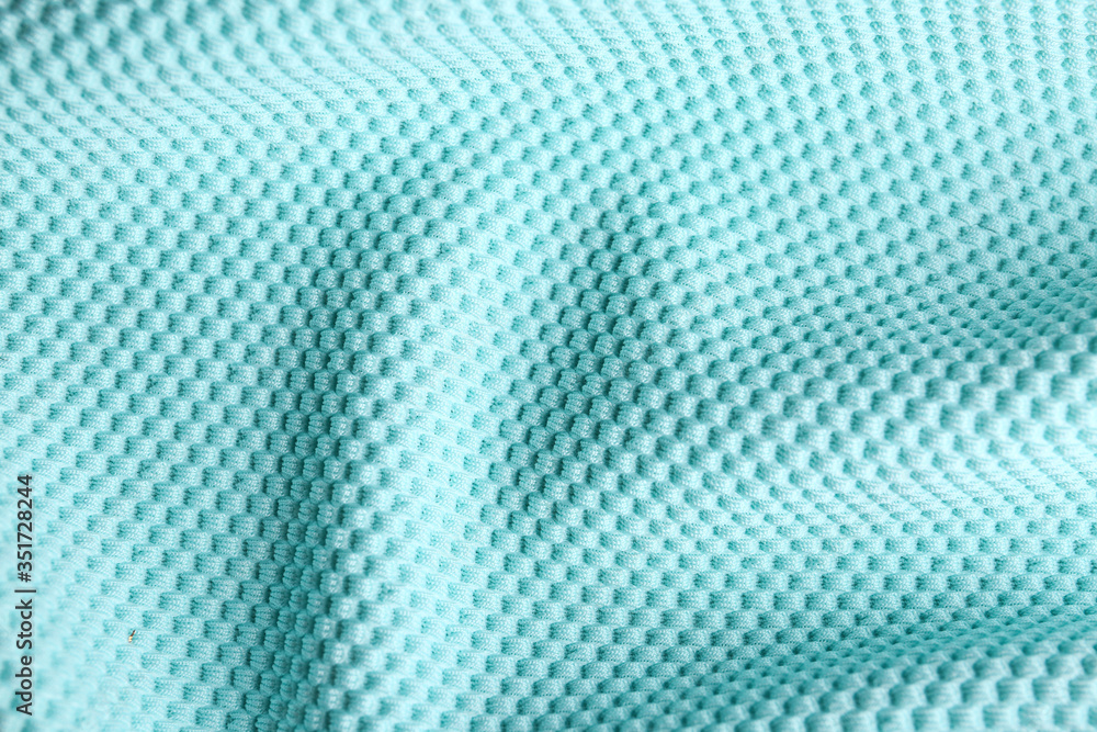 Fototapeta premium Textured light blue fabric as background, closeup