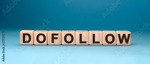 Dofollow - text concept on wooden cubes with gradient blue background