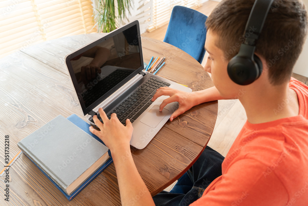 Teenage boy learning at home. Stock Photo | Adobe Stock