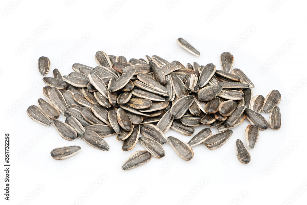 Group Delicious organic sunflower black seeds, isolated on white background