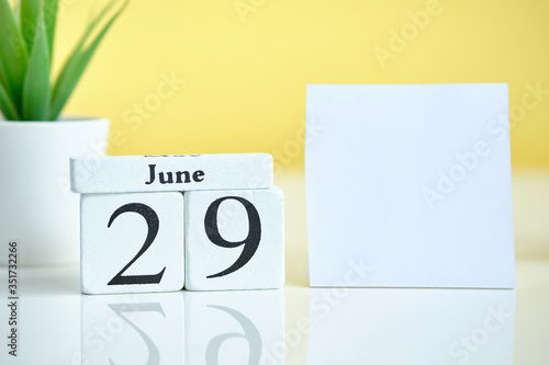 29 twenty ninth day june Month Calendar Concept on Wooden Blocks. Copy space.