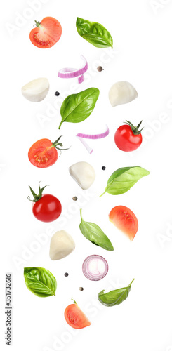 Wallpaper Mural Mozzarella cheese, tomatoes, onion and basil leaves falling on white background Torontodigital.ca