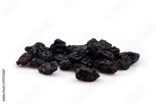 Organic Black raisins on white background