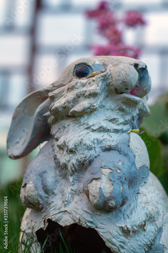 Garden figurine on grass background close-up © Alex