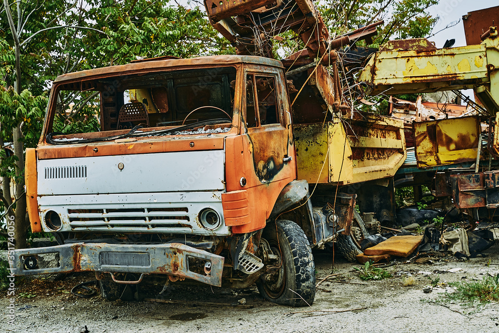 Old abandoned rusty wrecked Kamaz car. Kamaz in a landfill.
