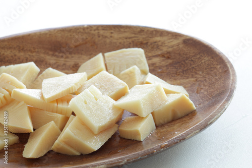 Boiled bamboo shoots on wooden plate with copy space