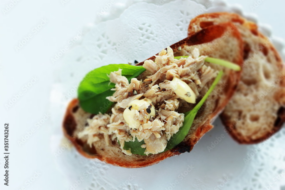Tuna fish and baby leaves open sandwich for healthy breakfast Tuna fish and baby leaves open sandwich for healthy breakfast