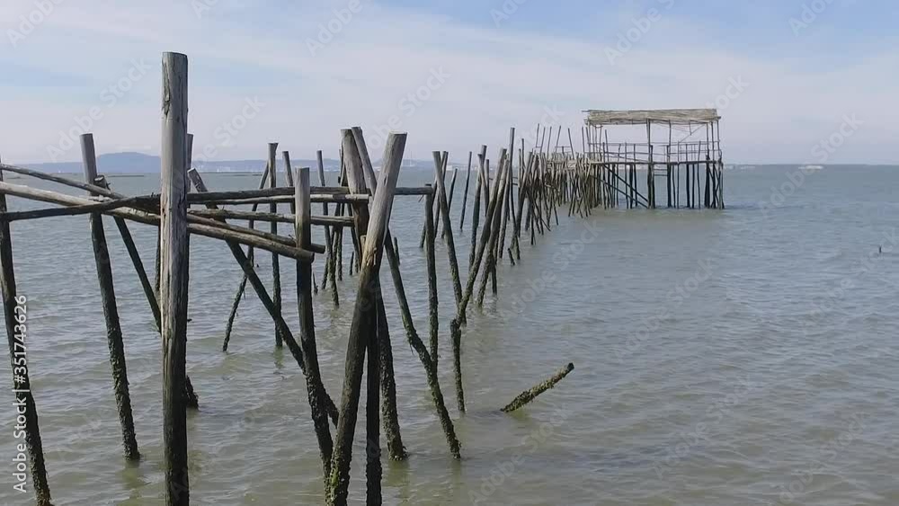 Old wooden fishing port with low tide carrasqueira portugal slow motion Old wooden fishing port with low tide carrasqueira portugal slow motion