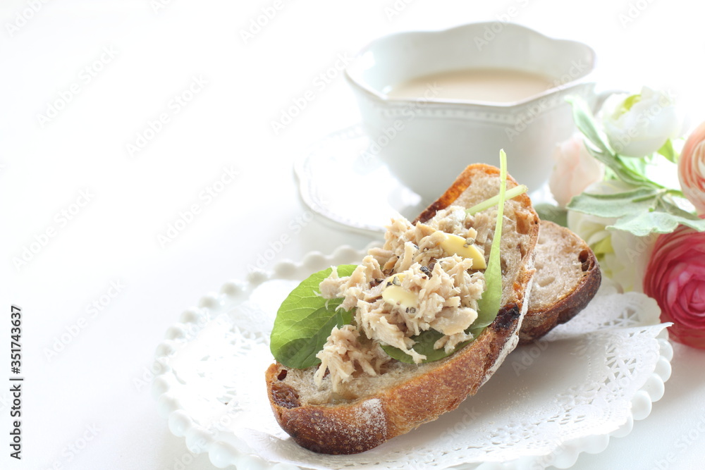 Tuna fish and baby leaves open sandwich for healthy breakfast