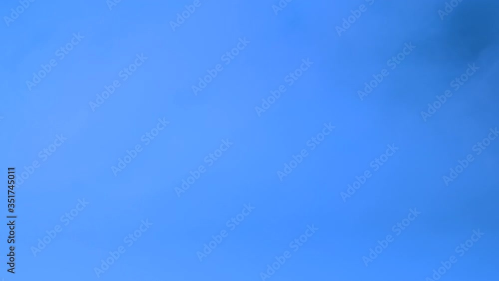 White vapor flowing over blue background White vapor flowing over blue background