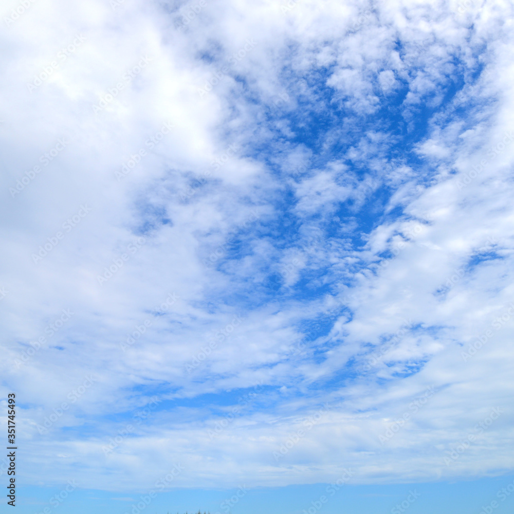 The blue sky and motion white fluffy clouds The blue sky and motion white fluffy clouds