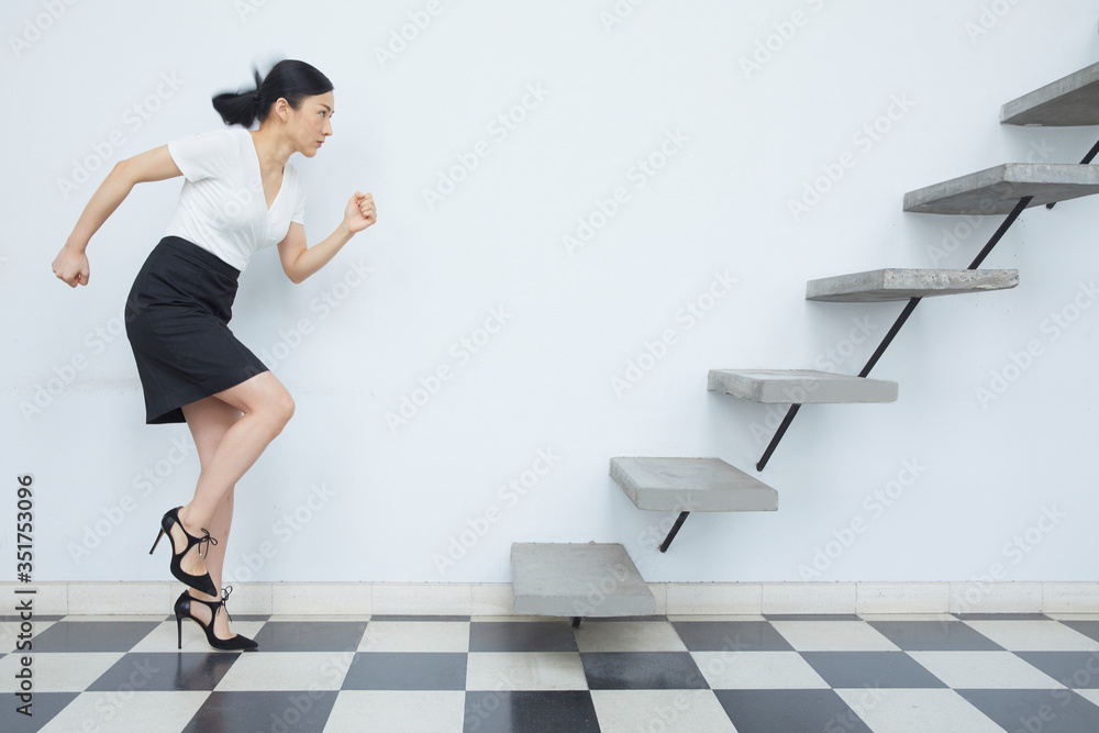 Businesswoman running up to stair in city,Growth of business concept. Businesswoman running up to stair in city,Growth of business concept.