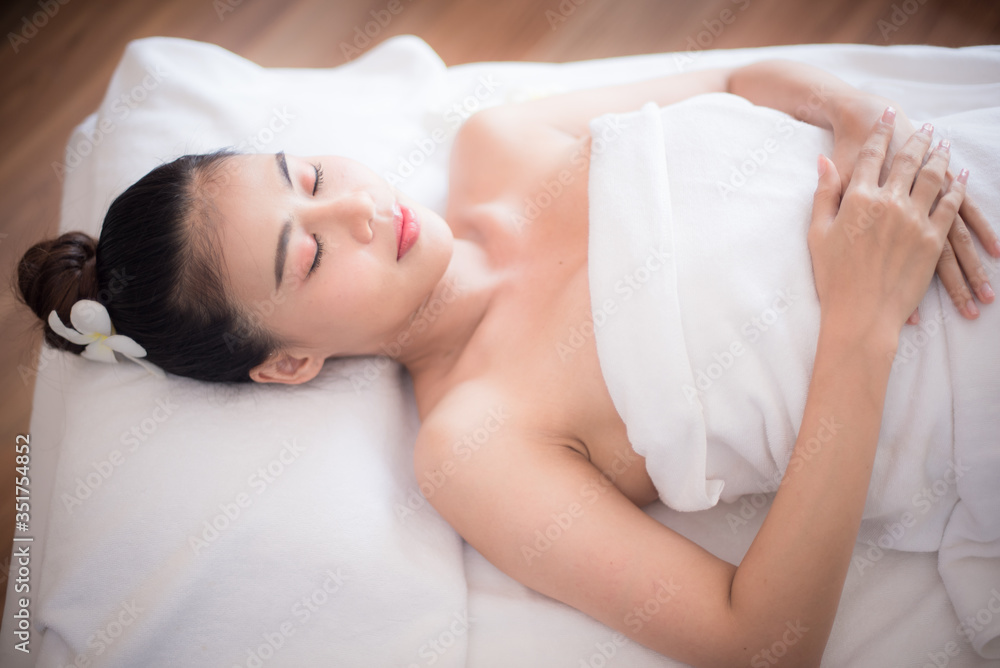 Body care. Spa body massage Asian woman hands treatment. Woman having massage in the spa salon Body care. Spa body massage Asian woman hands treatment. Woman having massage in the spa salon