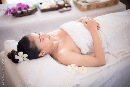 Body care. Spa body massage Asian woman hands treatment. Woman having massage in the spa salon