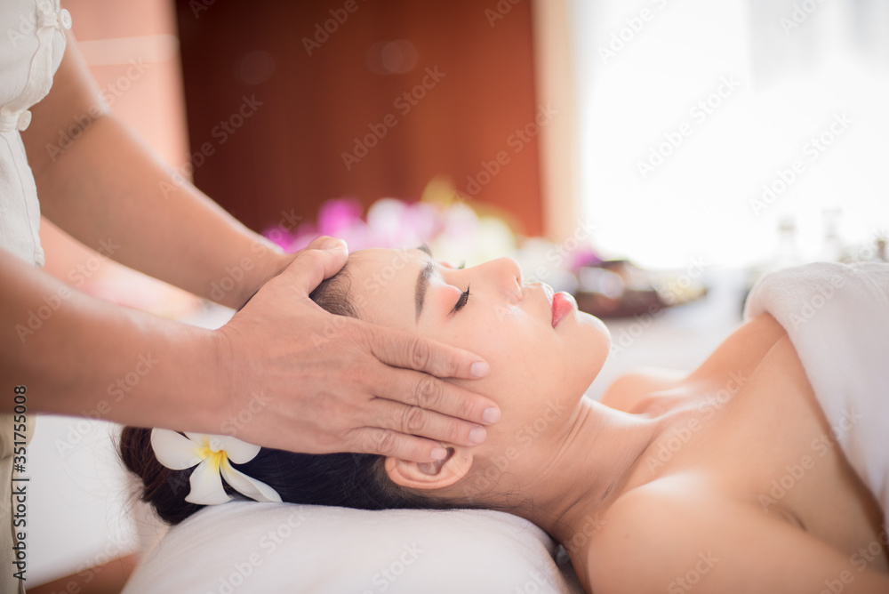 Body care. Spa body massage Asian woman hands treatment. Woman having massage in the spa salon Body care. Spa body massage Asian woman hands treatment. Woman having massage in the spa salon
