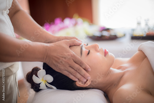 Body care. Spa body massage Asian woman hands treatment. Woman having massage in the spa salon © NITIKAN T.