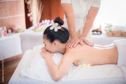 Body care. Spa body massage Asian woman hands treatment. Woman having massage in the spa salon