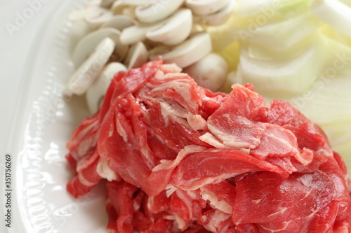 Raw food ingredient, beef and onion with sliced mushroom,