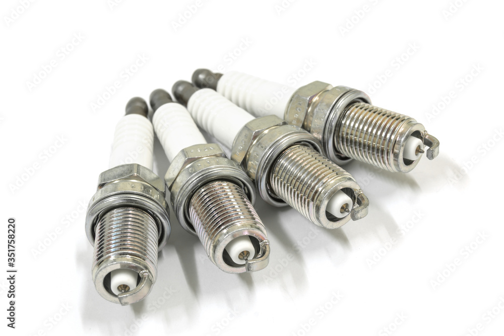 New spark plug on white background, isolated. New spark plug on white background, isolated.