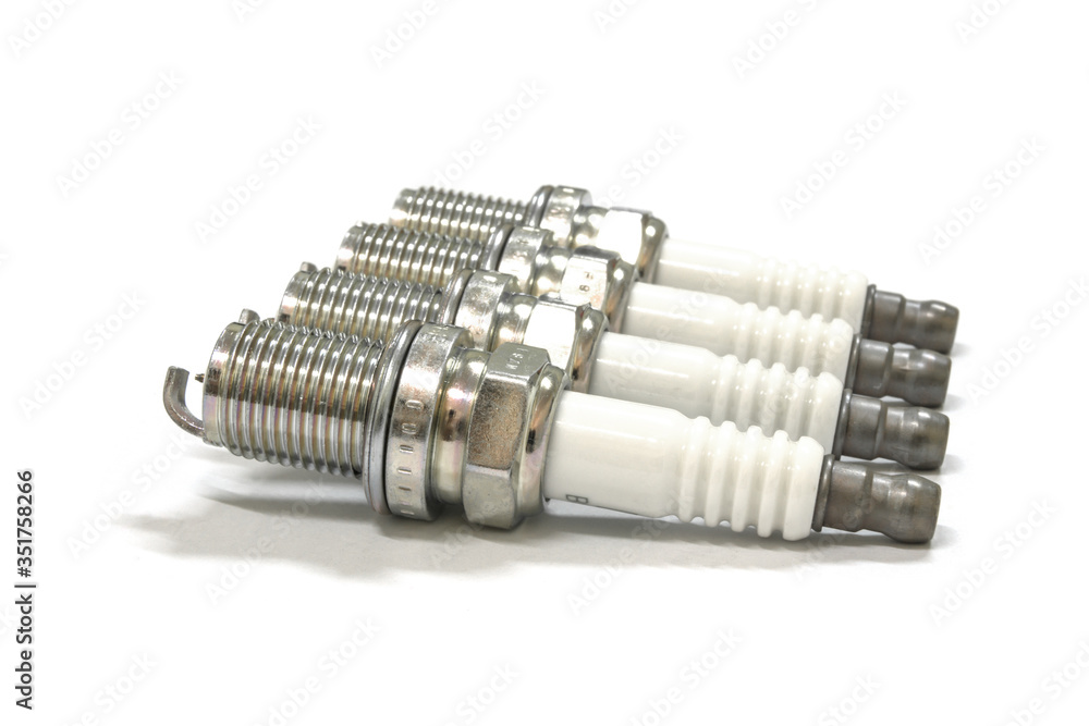 New spark plug on white background, isolated. New spark plug on white background, isolated.
